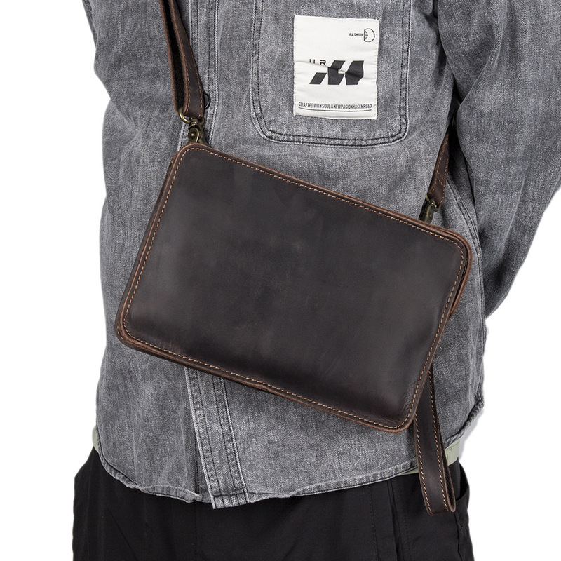 The man is holding a leather s - đánh giá và giá Interior Design Its